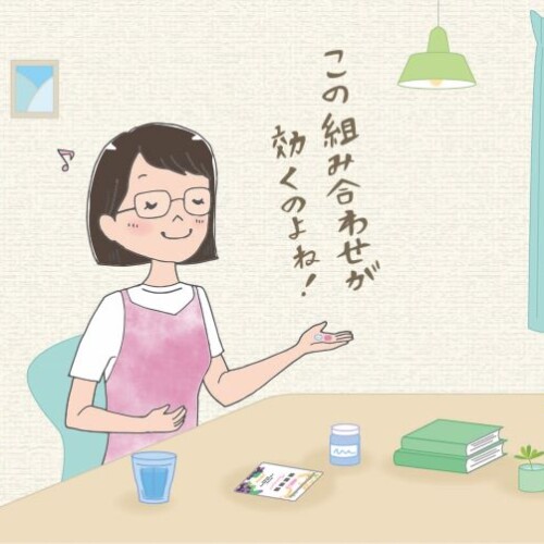 サプリを飲む女性